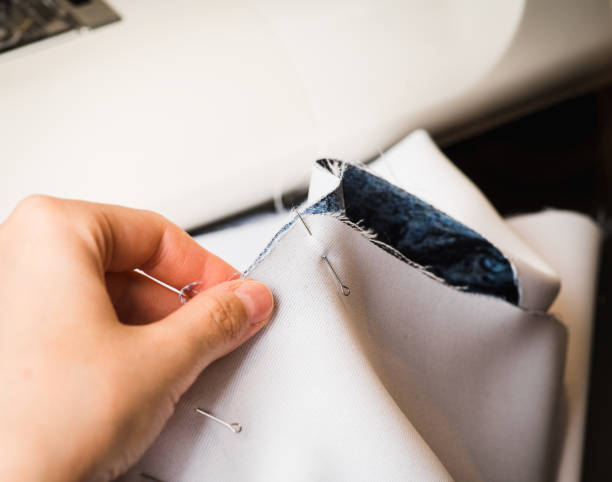 istock Young tailor sewing christmas decorations for children's party. Selective focus. Shallow depth of field 1291908933