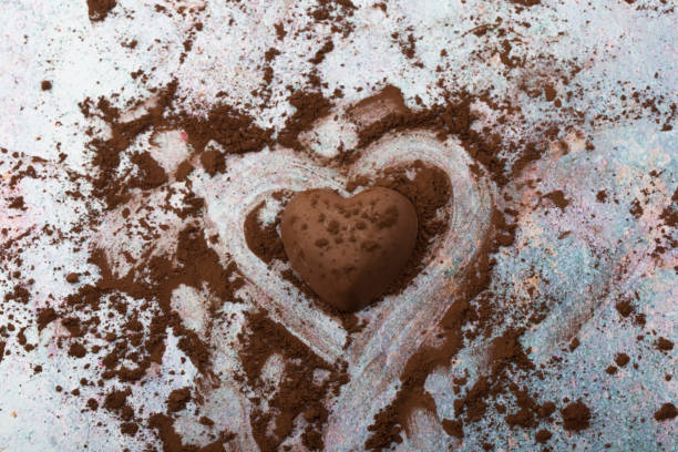 istock heart shaped chocolate isolated on white background. 1291909026