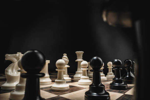istock Macro shot of wooden chess figures on board 1291909434