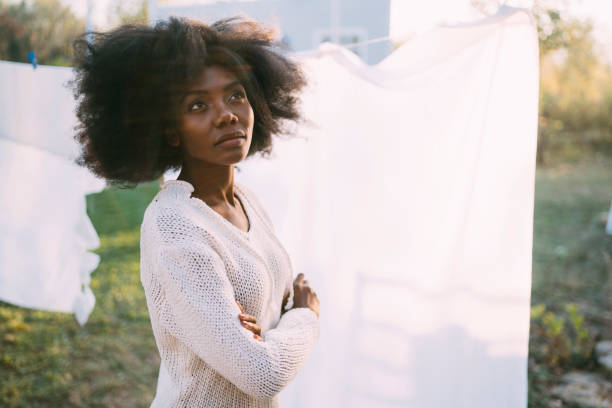 istock Desperate Young housewife standing in her back yard 1291910864