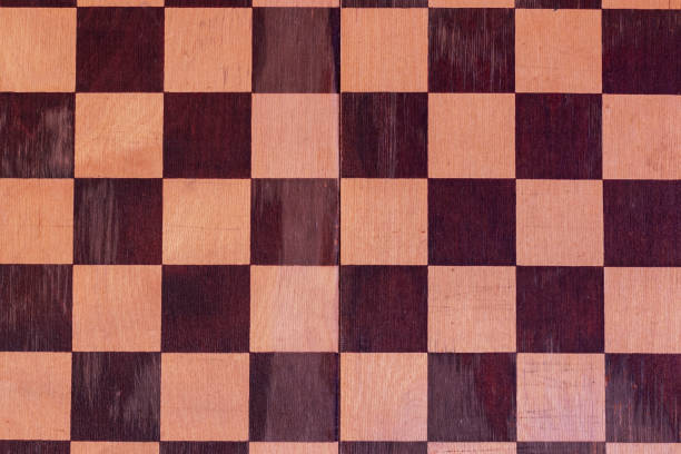 istock The surface of an old scratched checkerboard. 1291914132