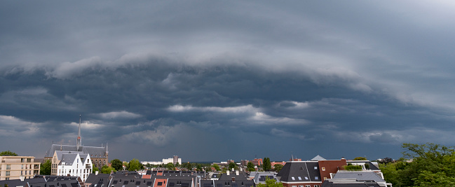 Heavy storm with rain and dramatic clouds over the city center of A Coruna, Northern Spain - Atlantic Ocean. Dark clouds with loads of heavy rain visible.