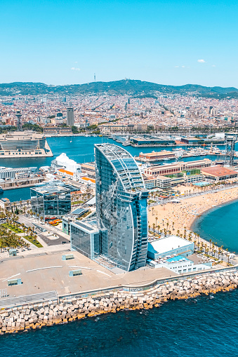 Front of Barcelona from the air with the port, the business center and the hotel