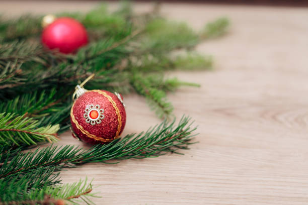 istock Christmas Tree Branches and on a Wooden Background with Copy Space 1291916177