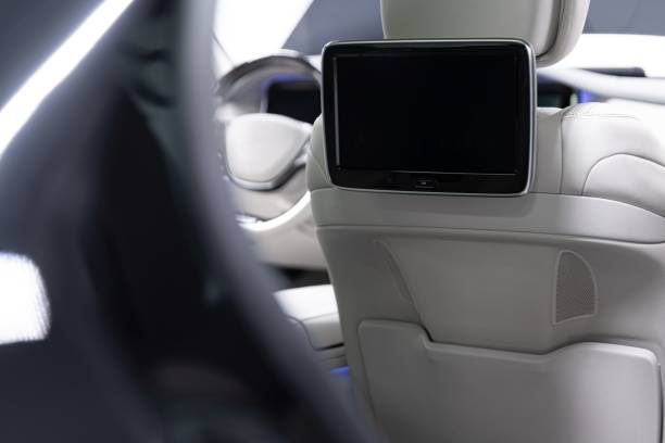 istock Modern luxury car interior with empty touchscreen monitor with copy space. 1291916220