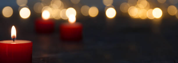 istock Candles with festive golden bokeh 1291917279