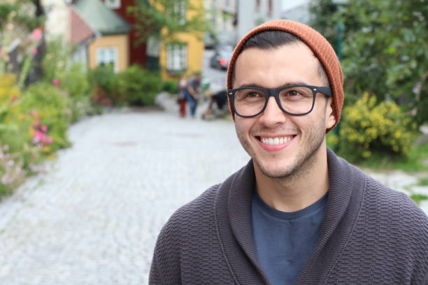 istock Ethnic hipster wearing eyeglasses and knit hat 1291917459