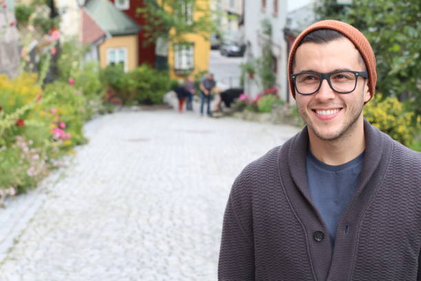 istock Ethnic hipster wearing eyeglasses and knit hat 1291917463