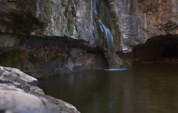 Photo of Gran Canaria, small freshwater pool in Tejeda municipality called Charco de la Paloma, ie Dove Pool water is running after winter rains