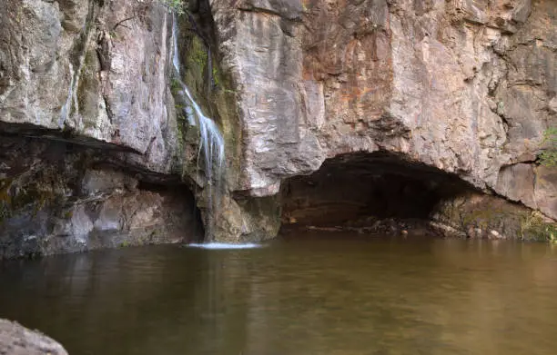 Photo of Gran Canaria, small freshwater pool in Tejeda municipality called Charco de la Paloma, ie Dove Pool water is running after winter rains