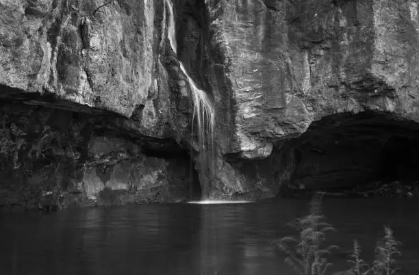 Photo of Gran Canaria, small freshwater pool in Tejeda municipality called Charco de la Paloma, ie Dove Pool water is running after winter rains