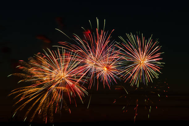 istock Bright colored fireworks on a festive night. Explosions of colored fire in the sky. 1291918854