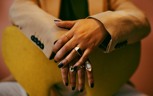 Closeup shot of fashionable rings on a woman's hands