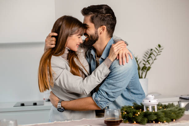 istock Couple celebrating Christmas at home 1291930838