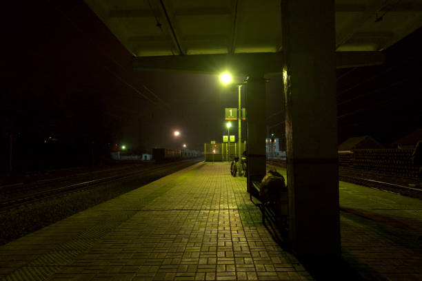 The platform of railway station at night.