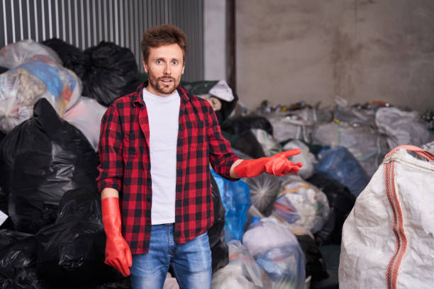 istock Man showing with hand to the garbage 1291936518