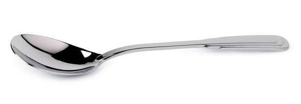istock Metal steel spoon isolated on white background 1291937644