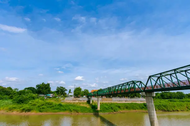 A pedestrian bridge over the Pa Sak River at Satue Temple, Ayutthaya Province in Thailand