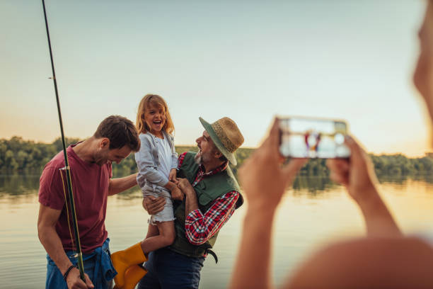 istock Smiling family having a good time while taking a photo 1291944443
