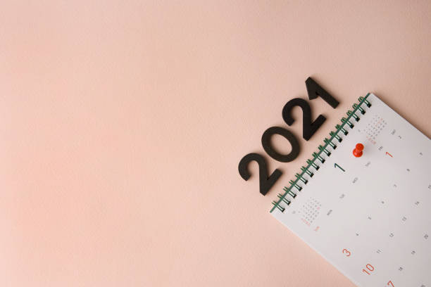 istock New Year 2021 calendar on pink background 1291944902