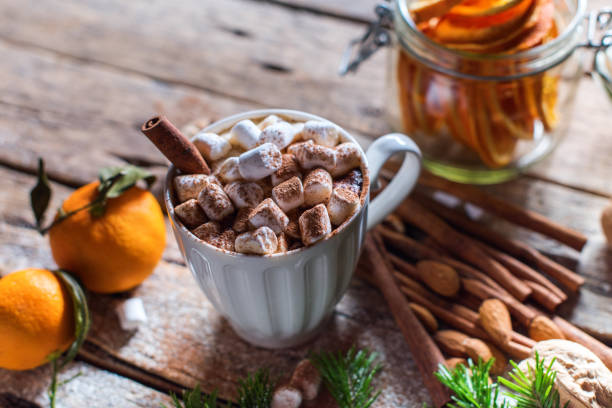 istock White cup of hot beverage with marshmallows cinnamon 1291945942