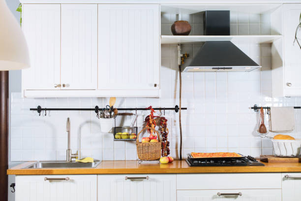 istock White interior kitchen facade and wooden table top 1291945987