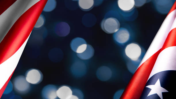 istock American flags border over defocused blue bokeh lights background. Flyer. 1291947649