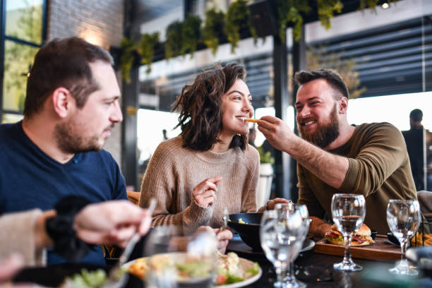 istock Friends Enjoying Lunch Time Together 1291949440