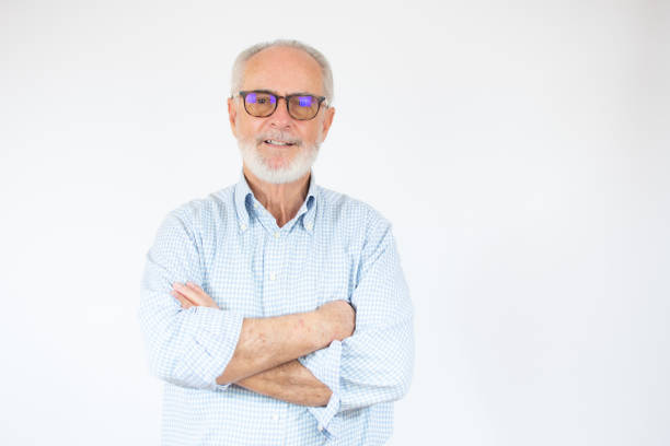 istock Happy Mature Man With Arms Crossed over white background. 1291955224