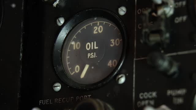 Oil Gauge inside an old Jet Fighter. Close-Up.