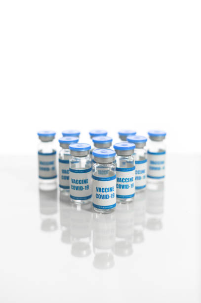 istock Vials of coronavirus vaccine isolated on white 1291958145