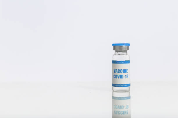 istock A glass bottle with a coronavirus, covid vaccine 1291958208