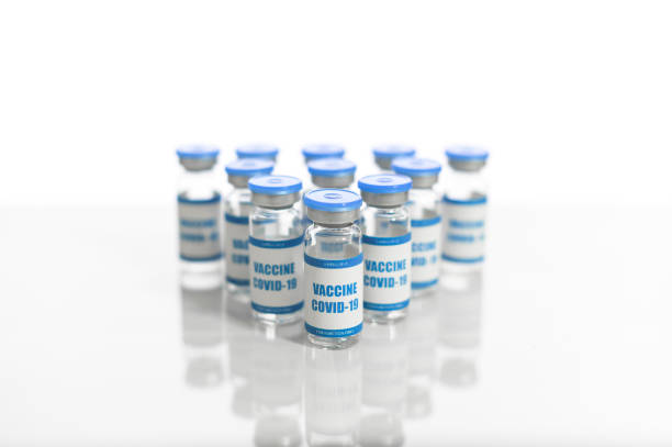 istock Vials of coronavirus vaccine isolated on white 1291959051