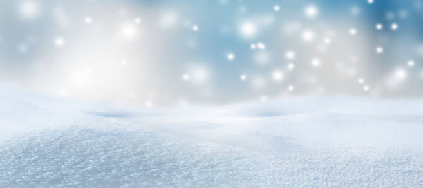 istock Blurred snowy background with snowflakes 1291959320