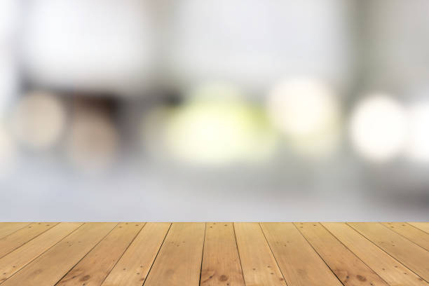 istock Empty wooden board empty table in front of blurred background. 1291959551