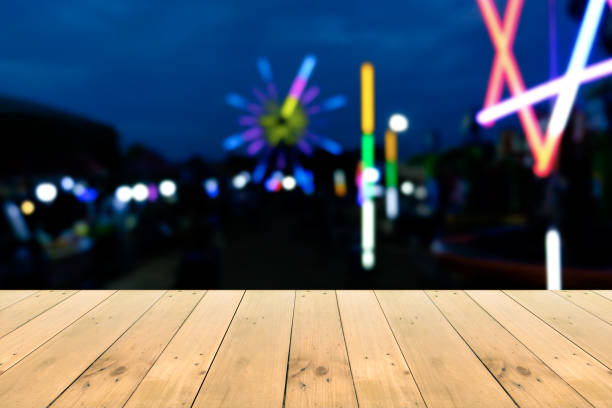 istock Empty wooden board empty table in front of blurred background. 1291959604