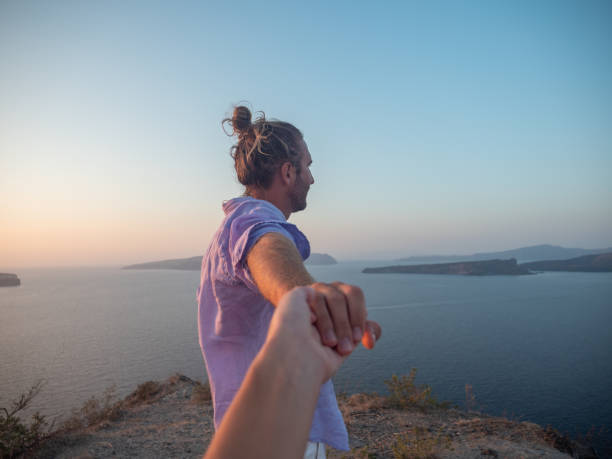 istock Couple holding hands in Greece 1291961139