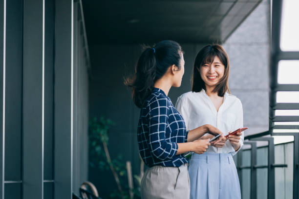 istock Asian chinese white collar worker teamwork discussion in the office 1291961176