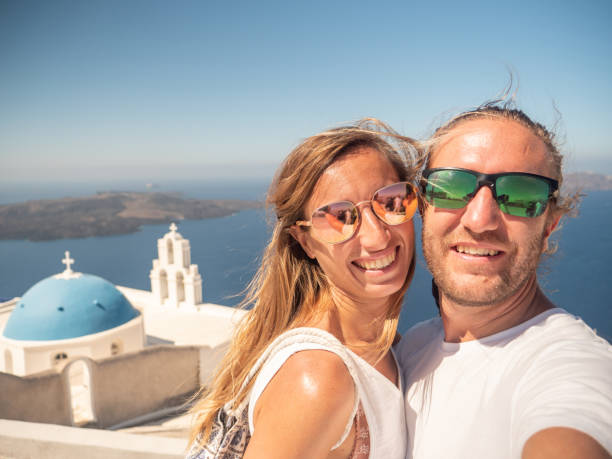 istock Tourists take selfie in Santorini 1291961294