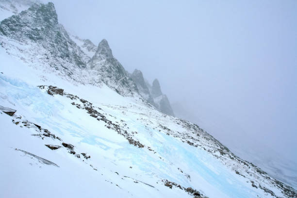 istock Baikal mountains in winter in snow. Forest in snow covered mount 1291961432