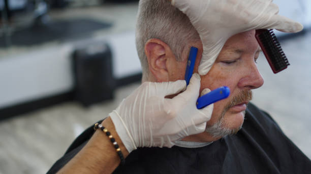 istock Gray haired man getting a haircut 1291961788