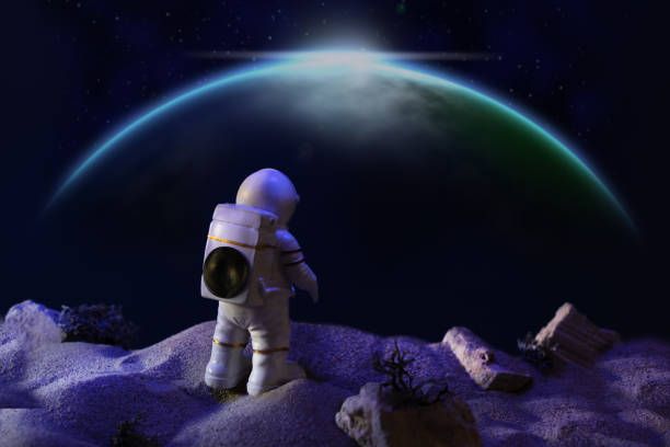 istock Astronaut in a space suit looking at galaxy. 1291967224