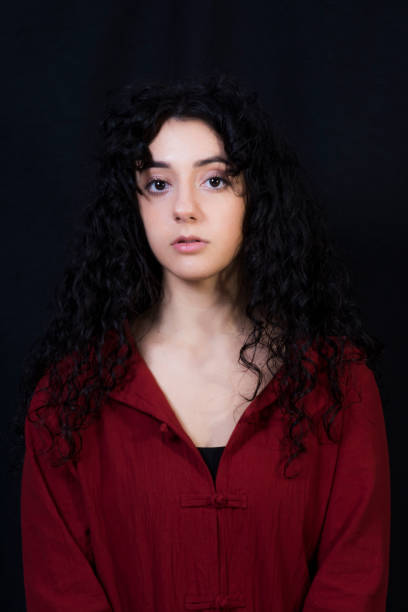 istock Beautiful woman on black background 1291967302