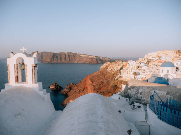 istock Oia town at sunset, blue domes 1291971346