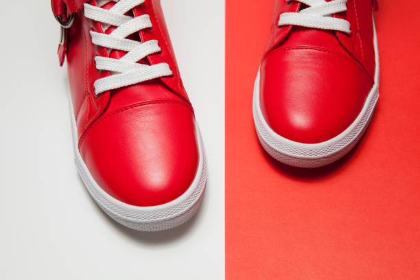 istock Sport red leather shoes on white background 1291972230