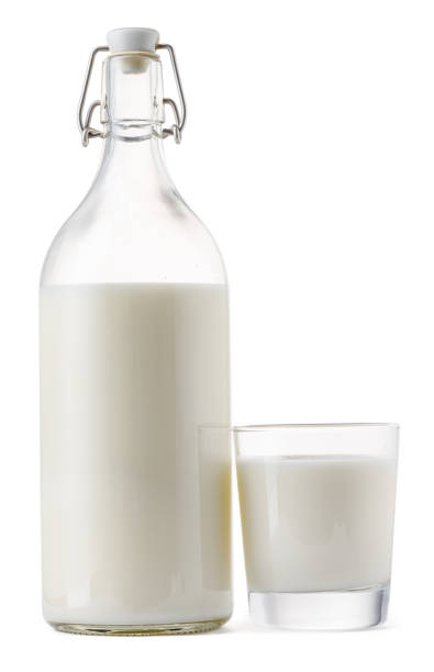 istock Closed glass milk bottle isolated on white background 1291975063