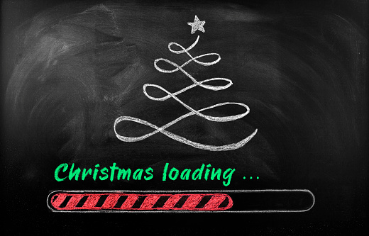 Christmas loading candy cane on blackboard