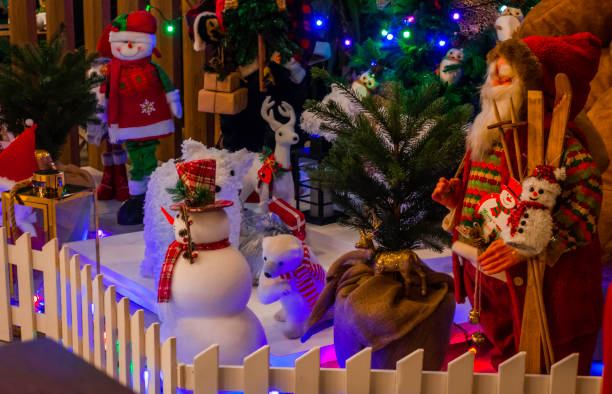 istock Composition with Christmas tree, Santa Claus, Snow Man and decorations 1291979120