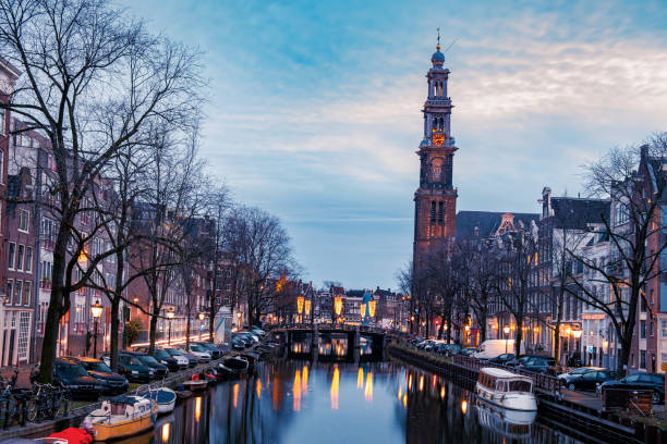 istock Amsterdam Netherlands, canals with lights during evening in December during wintertime in the Netherlands Amsterdam city 1291979405