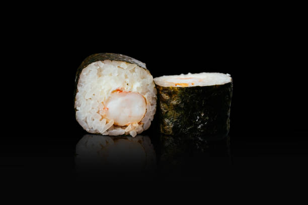 Japanese sushi rolls on a black background